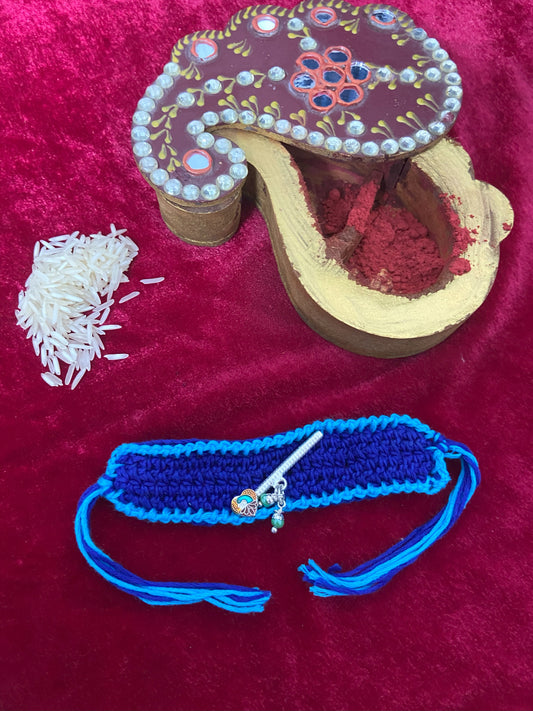 Crochet Rakhi with Silver Bansuri Charm