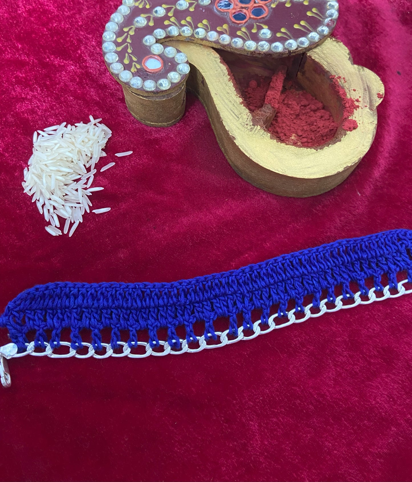 "Threaded Grace – Crochet Rakhi with Elegant Silver Chain Accent"